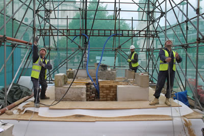 Lewis and Jim using the overhead pulley and hoist