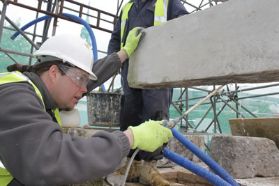 Wetting the underside of a stone for fixing